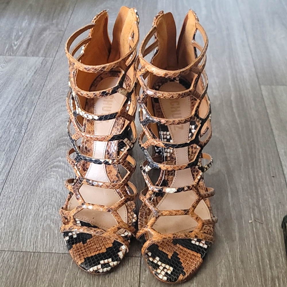 Brown and black snake skin heels